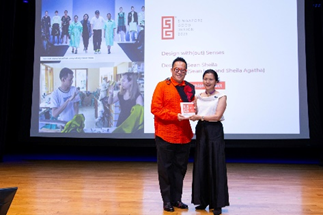 Mr ONG Kai How (RafflesDesign) receiving the award on behalf of Raffles Fashion Designers, Mr Sean LOH and Ms Sheila WIJAYA.